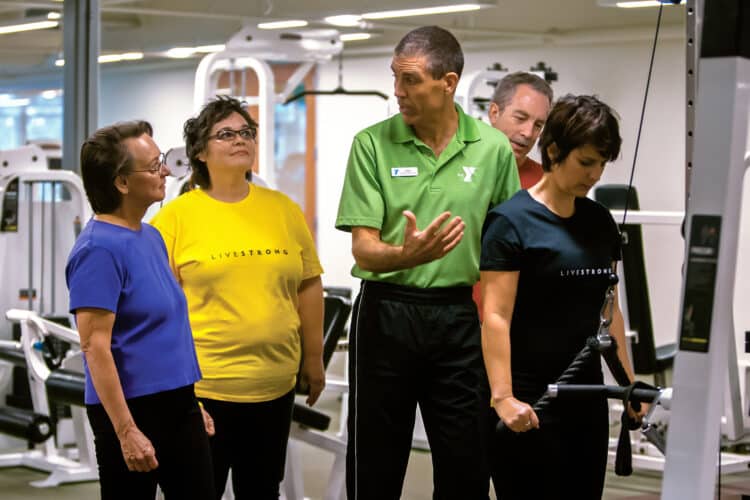 Man leading fitness group in gym | YMCA Ocean Community | YMCA In Rhode Island