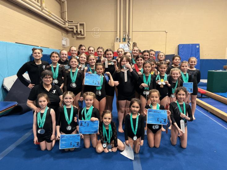 Children standing together with awards from the Ocean Community YMCA